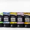 Pack of Beezle Bites solventless cannabis chews in different flavors, displaying 10mg THC per chew and 100mg total on vibrant packaging.